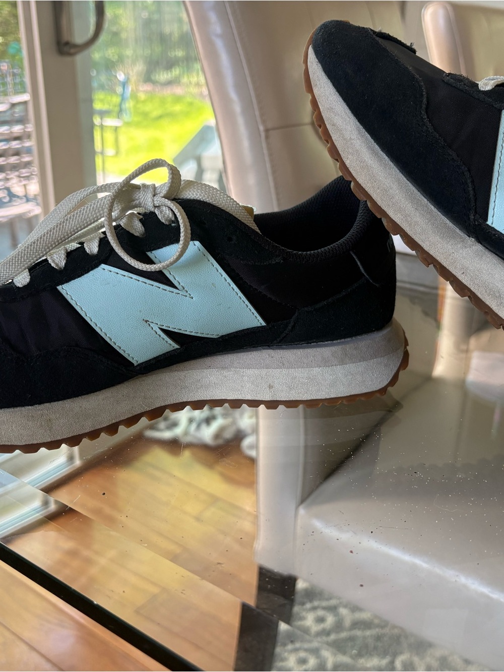 New Balance Women's Sneakers in Black and White with Gum Soles